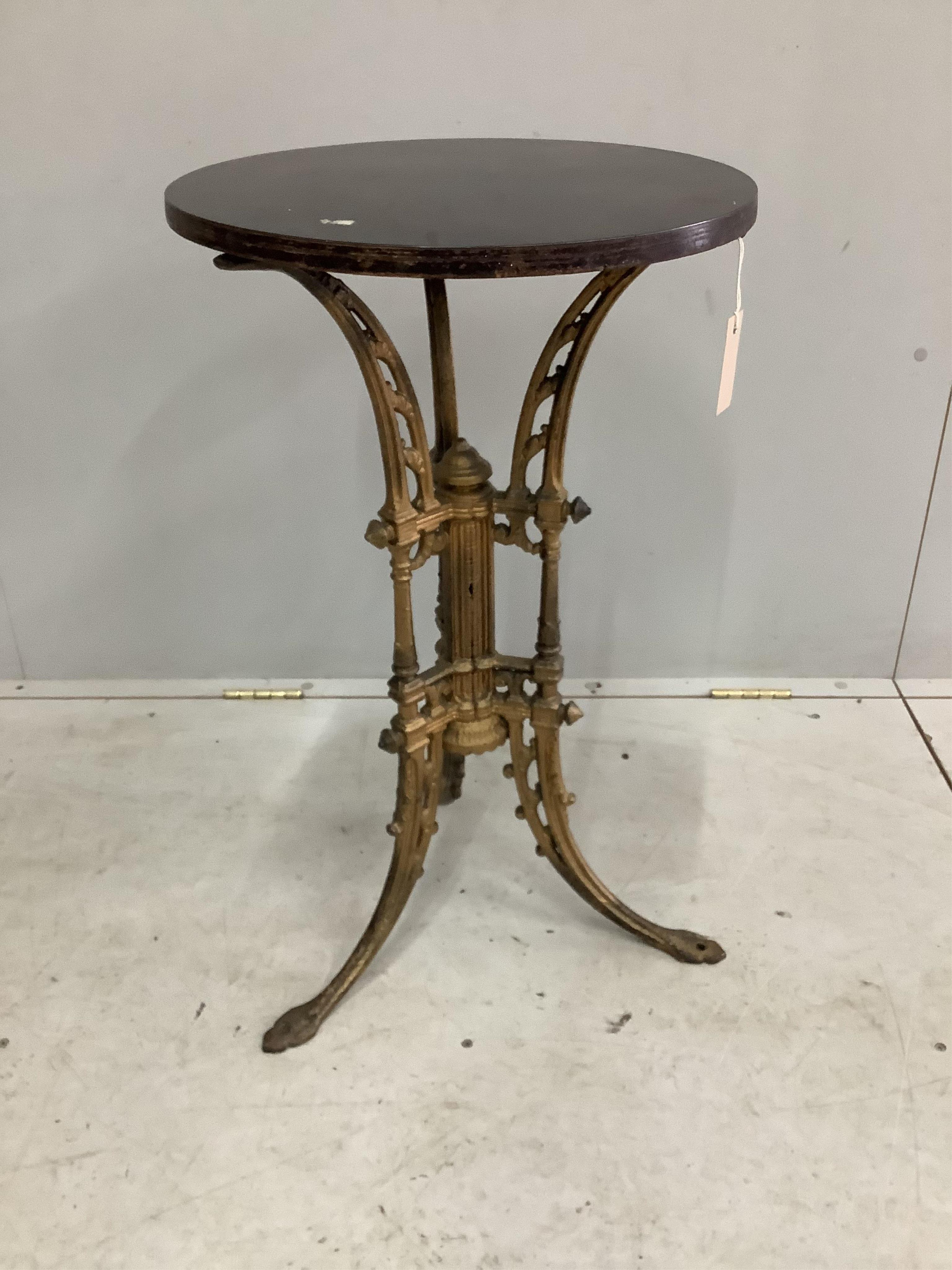 A Victorian gold painted cast iron occasional table with later top, diameter 43cm, height 73cm. Condition - fair